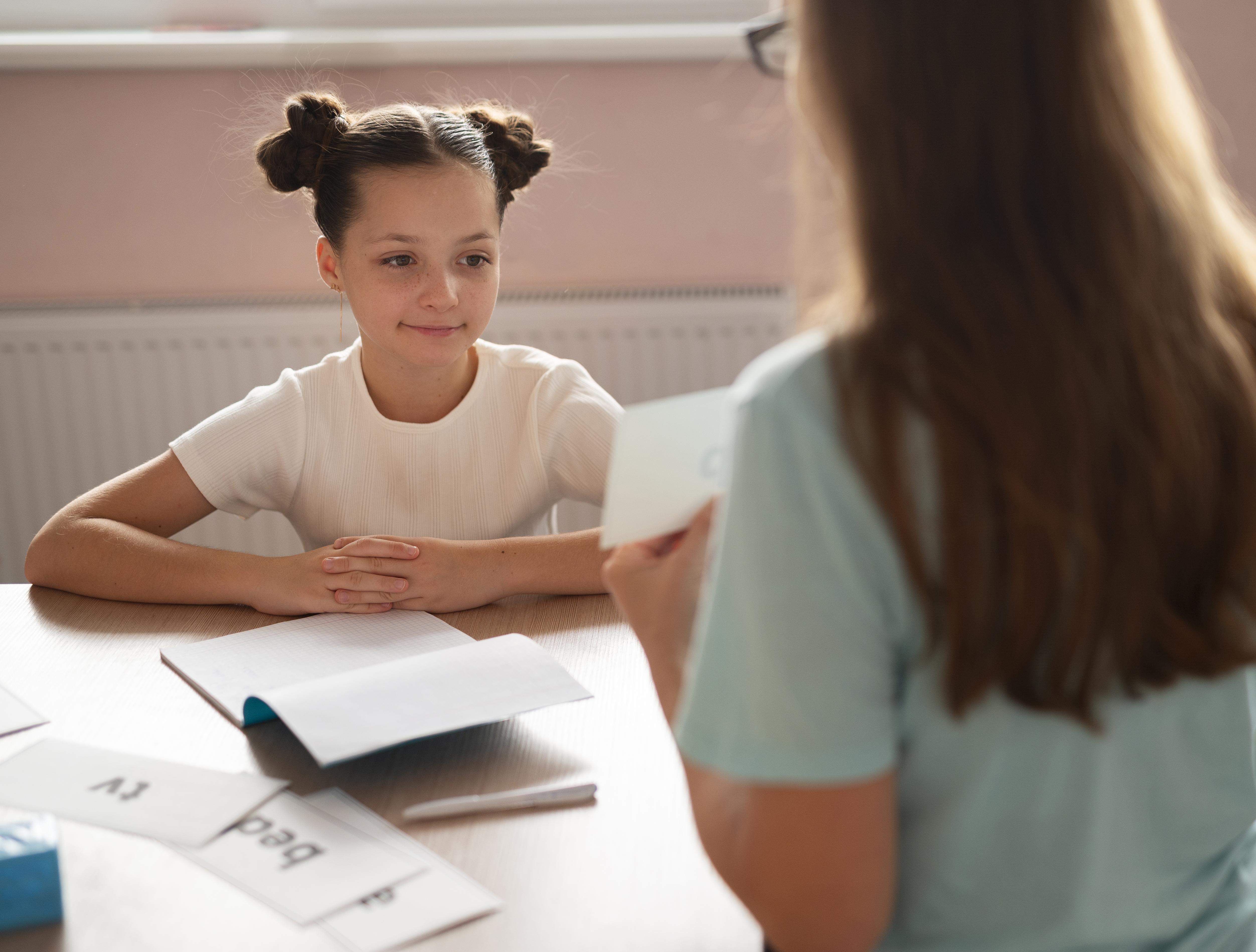 therapist and child doing a comprehensive speech pathology evaluation